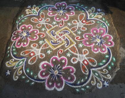 Rangoli: Rev's swasthik, chikku & flower kolam.